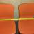 Set of 2 orange non-stacking chairs 2 thumbnail