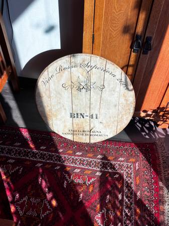 Wine barrel lid wall hanger. 1