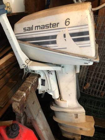 1985 Johnson 6 HP 2 cycle outboard motor & fuel tank. 1