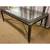 Coffee table with glass top, metal frame, and decorative trim. Sturdy legs. Mino 1 thumbnail