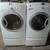 GE stackable front load washing machine and electric dryer on pedesta 1 thumbnail