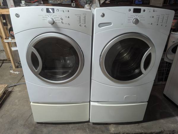 GE stackable front load washing machine and electric dryer on pedesta 1