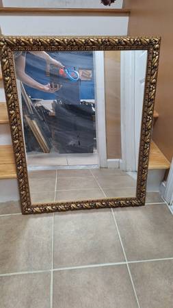 Wall mirror with a "gold" colored frame 1