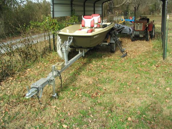 Sun Dolphin 12 ft boat with trailer 2 motors, oars and life vests. 1