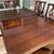 Dining room table with 10 chairs, and 2 leafs for expansion 1 thumbnail