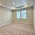 The open-concept kitchen is equipped with stainless steel appliances 14 thumbnail