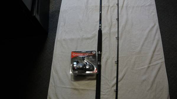 Okuma reel in original package an 10 ft Quantum rod 1