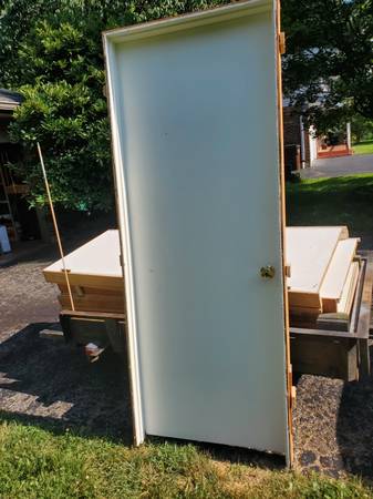 Six used interior pre-hung doors w/ casing, hinges, & knob 1
