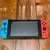 Nintendo switch with case and Nintendo pro controller 1 thumbnail