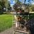 three stacked rabbit cages with two nesting boxes and three water bottles on whe 2 thumbnail