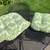 4 nice, slightly used patio chair cushions. Off-white/Tan + green. 2 thumbnail