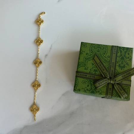 Van Cleef & Arpel18 k yellow gold, five motif bracelet over 925 silver 1