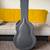 Grey acoustic guitar case 1 thumbnail