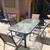 5 Piece Patio Set. Glass top table and 4 stackable chairs. 1 thumbnail