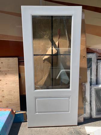 3' x 6'8" four light prefinished  exterior door 1
