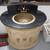 small brass sink mounted in a half moon vanity with black stone top 2 thumbnail