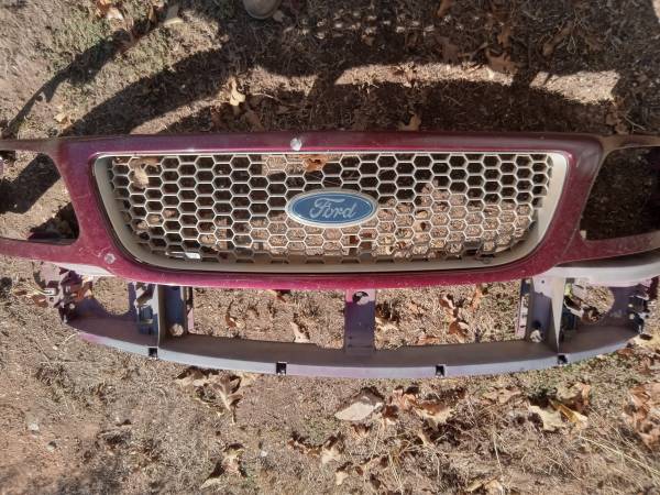Ford front grill plastic and headlight support 1