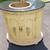 small brass sink mounted in a half moon vanity with black stone top 3 thumbnail