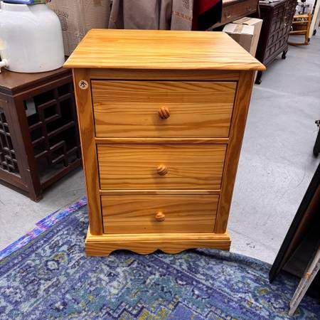 Solid Brazilian pine three drawer nightstand in a warm honey finish 1
