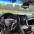Luxurious SUV with a brown interior and black exterior. 4 thumbnail