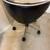 A black rolling pedicure or low-back salon/task stool with a curved backrest 5 thumbnail