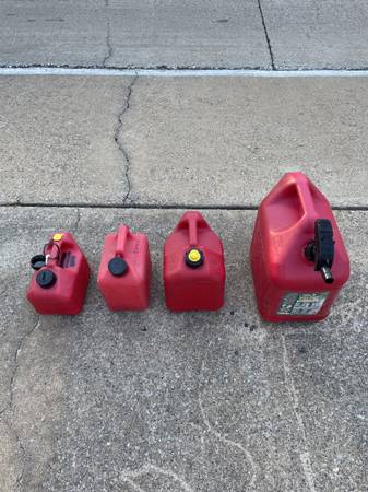Four Plastic Gas Cans 1