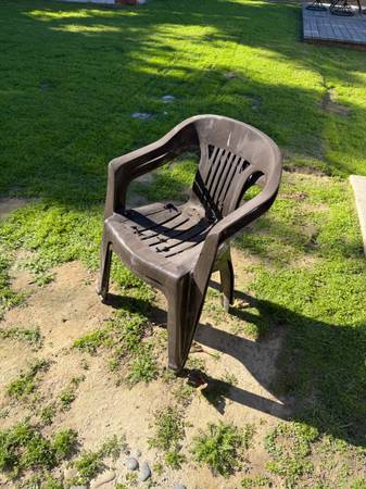 2 brown plastic chairs 1