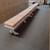 Five white benches with cushions. 1 thumbnail