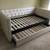 Tufted beige linen daybed with nailhead trim and trundle - New 1 thumbnail