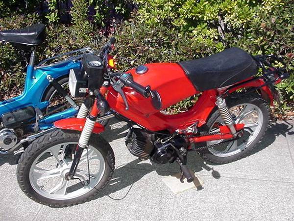Barter / Trade a RED Tomos Moped, runs and has the rare kick starter, 1