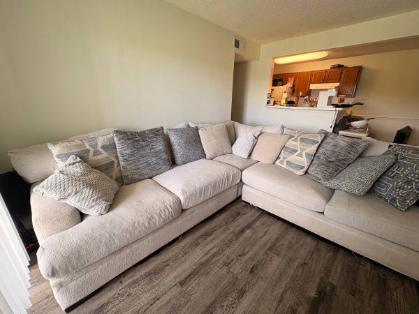 L-shaped beige couch 1