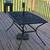 Wrought Iron Patio table and 4 matching chairs, w/umbrella stand. 1 thumbnail