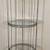 Large tall Wrought Iron 4 tier circular stand,c/w glass shelves 1 thumbnail