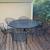 Wrought iron patio table and six stackable chairs with matching bench 2 thumbnail