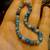 beaded stretch bracelet featuring blue grey stone beads turquoise or blue jade 2 thumbnail
