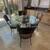 Glass table 48 inch round with wrought iron base 1 thumbnail