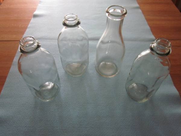 Four Clear Glass Milk Bottles 1