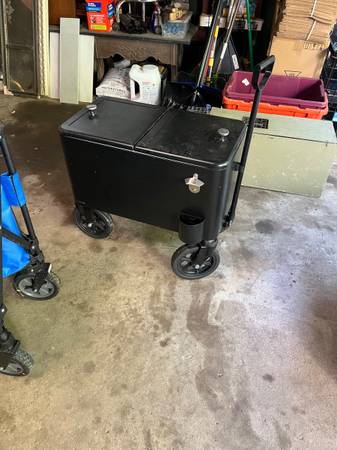 Black metal cooler on wheels 1