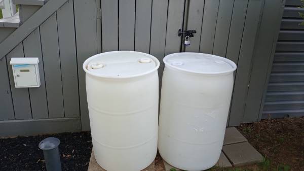 clear  - white plastic 55 gallon barrels / rain barrels 1