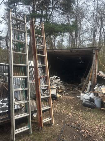 2 Extension Ladders (1fiberglasd/1aluminum 1