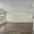 Wood-Inspired Flooring, 3 Courtyard with New BBQs, Carpeting 2 thumbnail