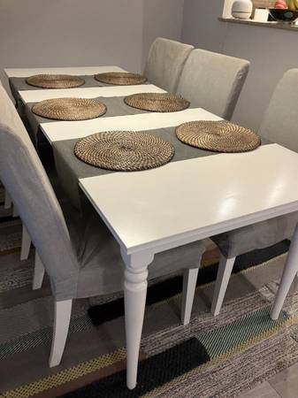 Like new IKEA white dining table with extension $155; 6 chairs; delivery 1
