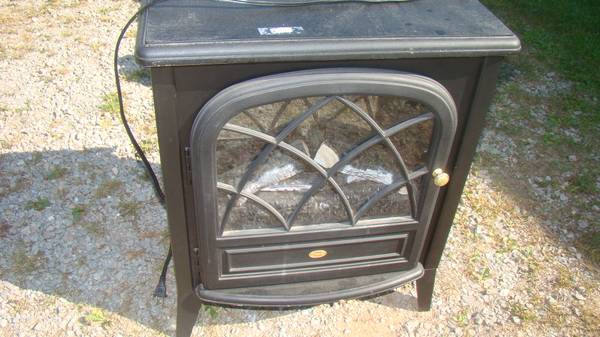 ELECTIC   FIRE PLACE HEATER 1