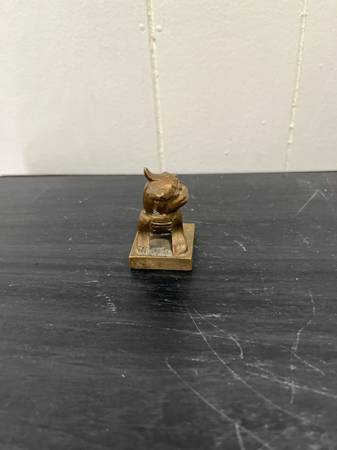 A small bronze FOO DOG figurine on a square base 1