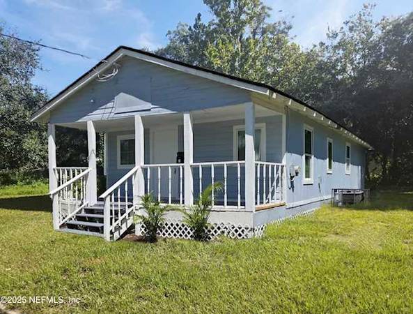 Enjoy the covered front porch or the low-maintenance 1