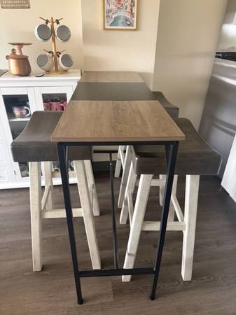 Bar-height table with 3 matching stools for sale. 1