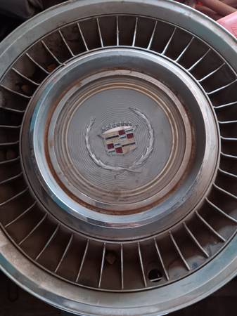 4 Cadillac hub caps 1