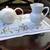 White tea pot with daisy design and a small pitcher. 1 thumbnail