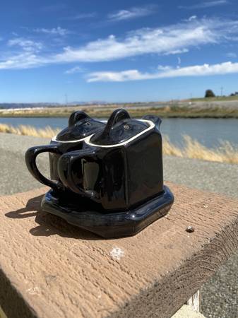 Black ceramic double tea pot set with base. 1