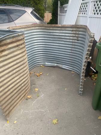 2 large window wells for egress windows, they are both a little dented 1